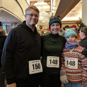 Picture of me and part of my family wearing our running gear before a turkey trott run in 2019